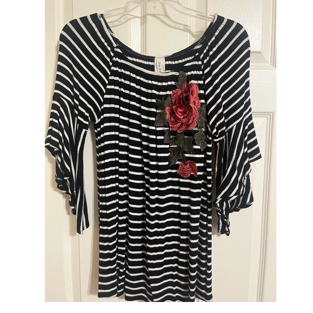 Ladies black and white stripe shirt with Rose detail